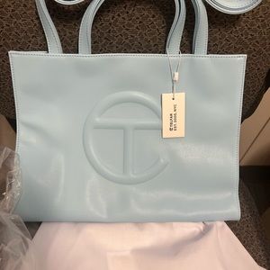Beautiful pool, blue Telfar shopping tote size medium.